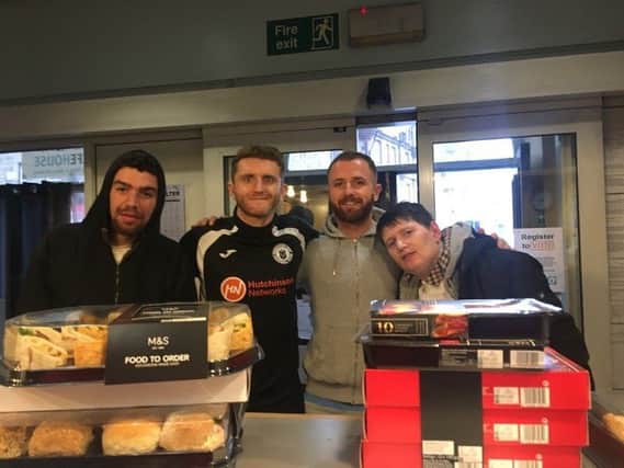 Jordan Caddow and Josh Walker handed over the hospitality supplies at the Pleasance Lifehouse. Picture: Contributed.