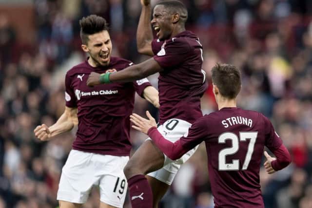 Arnaud Djoum celebrates after putting Hearts ahead against Hamilton