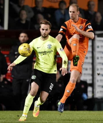Andrew Shinnie plays keep-ball with Dundee United's Frank van der Struijk during the 1-0 win at Tannadice. Pic: SNS
