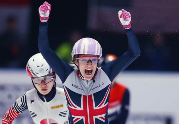 Elise Christie celebrates winning the women's 1000m final. Pic: AP