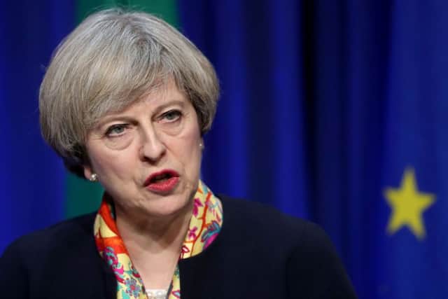 Sensitive documents setting out Theresa May's travel plans were left on a train in a blunder branded a "serious security breach" Picture; Neil Carson, PA