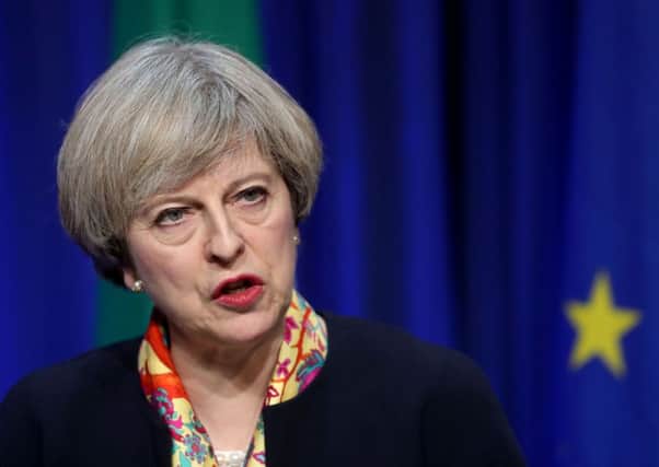 Sensitive documents setting out Theresa May's travel plans were left on a train in a blunder branded a "serious security breach" Picture; Neil Carson, PA
