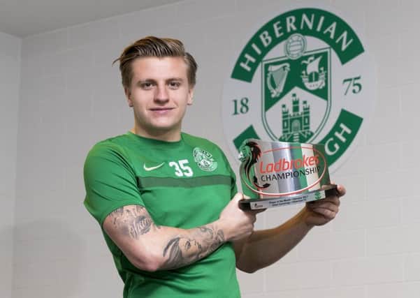 17/03/17
 HIBERNIAN TRAINING CENTRE - TRANENT
 Hibernian striker Jason Cummings is presented with the Ladbrokes Championship Player of the Month award for February