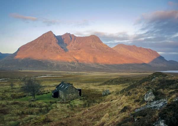 Bothy at dawn over Beinn Dearg Mor from Shenavall. PIC: Geoff Allan.