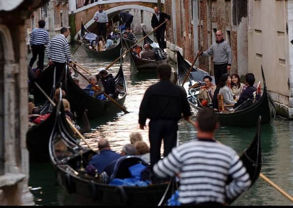 What could be more romantic than a gondola ride in Venice? Picture: Robert Perry