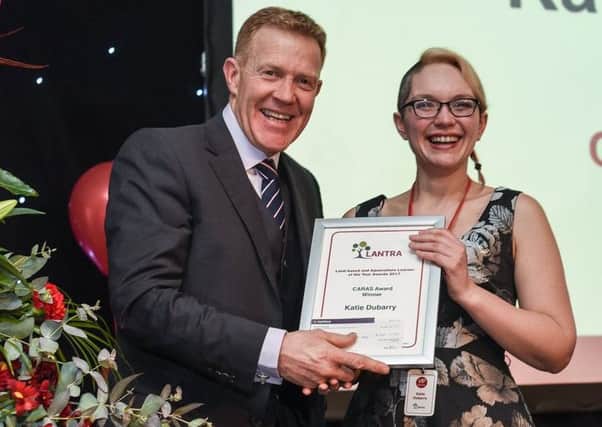 Katie Dubarry receives her CARAS award from Countryfiles Adam Henson