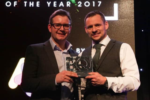 Shot Scope founder David Hunter, left, receives his award from We Are Boutique director Simon Bollon