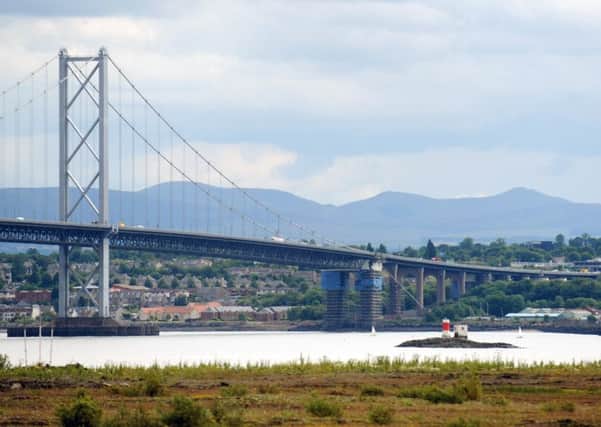 The Beamer Rock lighthouse beneath the Forth Road Bridge before its removal. Picture: Jane Barlow