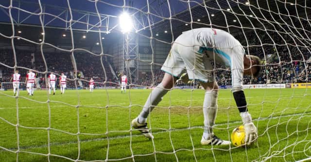 Bonnyrigg Rose goalkeeper picks the ball out of the net during the thrashing by Hibs. Andrews was dropped after that match. Pic: SNS