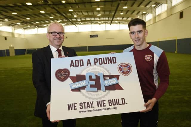 Jamie Walker, pictured alongside Foundation of Hearts chairman Stewart Wallace, is urging FOH members to increase their pledges by Â£1 to generate almost Â£100,000 for the Edinburgh club. FoH have 8,000 members and today launched a scheme to get each one to up their monthly donations, which provide Hearts with vital funds each year. Visit www.foundationofhearts.org for details. Pic: Greg Macvean