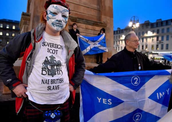 Independence supporters gather in Glasgows George Square Photograph: Jeff J Mitchell/Getty