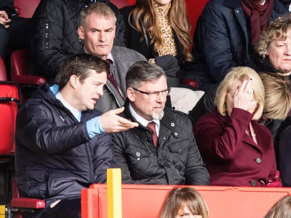 Craig Levein and Jon Daly in conversation during Aberdeen's win against Hearts.