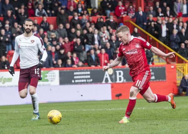 Aberdeen's Jonny Hayes takes the ball round Hearts keeper Jack Hamilton before doubling the lead. Pic: SNS