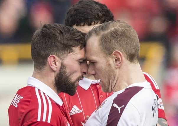 Aberdeen's Graeme Shinnie and Malaury Martin square up. Pic: SNS