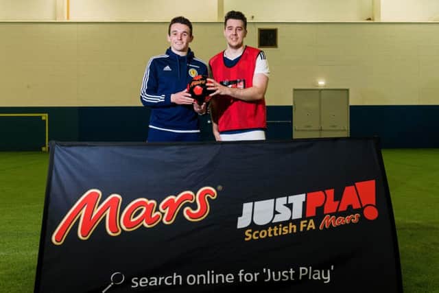 McGinn is joined by the Mars Just Play competition winner Graeme Richardson at Oriam. Pic: SNS