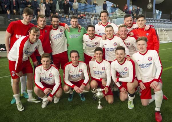 Spartans celebrate with the trophy. Picture: Ian Rutherford