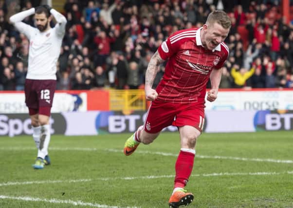 A jubilant Jonny Hayes wheels away to celebrate after latching on to Tasos Avlonitis short backpass. Pic: SNS