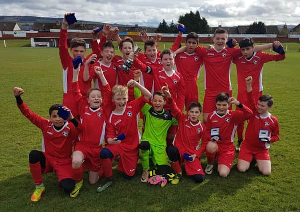 Edinburgh South Under-13s celebrate at New Dundas Park after winning the George Salmon Cup