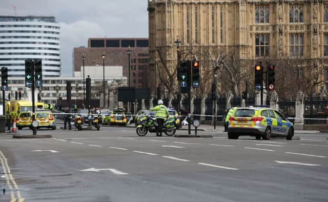 Police close to the Palace of Westminster, London, after policeman has been stabbed and his apparent attacker shot by officers in a major security incident at the Houses of Parliament. (photo: Jonathan Brady/PA Wire)