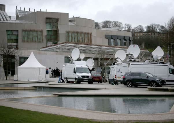 Media outside the Scottish Parliament in Edinburgh, ahead of the second day of debate on a potential second Scottish independence referendum. Picture: PA