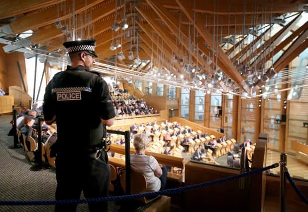 Police presence in the main chamber at the Scottish Parliament in Edinburgh.