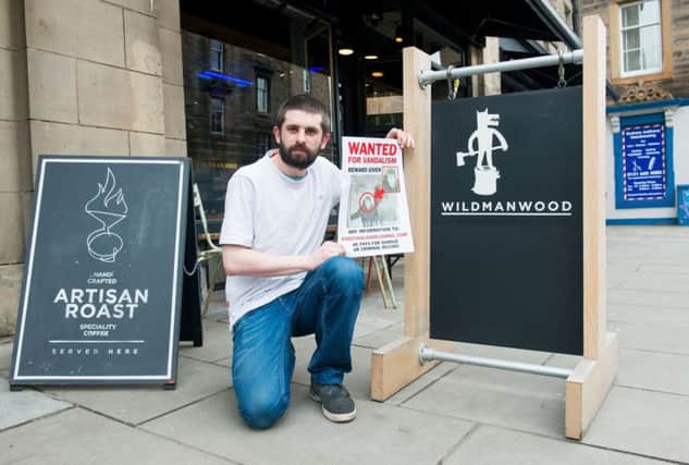 Head chef/Partner Marc Donkin with the Wanted poster at Wildmanwood.  Picture; Ian Georgeson