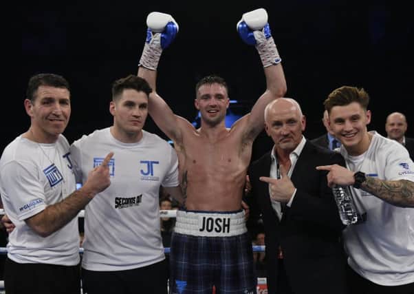 Josh Taylor celebrates with his team, including Barry McGuigan, second right. Pic: ANDREW O'BRIEN