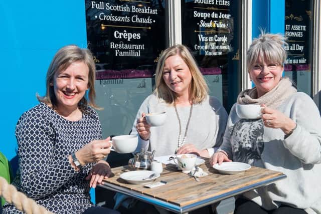Happiness is a place called Morningside. Sonya Angus, Tessa Henry, And Laura Woodham enjoy a coofee outside Maison Bleue Bistro. Picture; Ian Georgeson