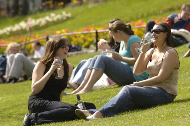 Revellers enjoy the sunshine in Princes St Gardens. Picture: Phil Wilkinson