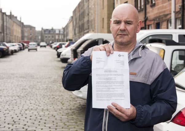 Robert Hunter with the letter from police laying out charges to collect his wifes stolen 14-year-old Corsa. Picture: Andrew O'Brien