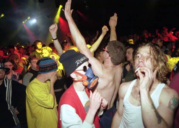 A boy wearing a gas mask at a rave held at Dalleagles farm near New Cumnock in June 1992. Picture: Allan Milligan/TSPL