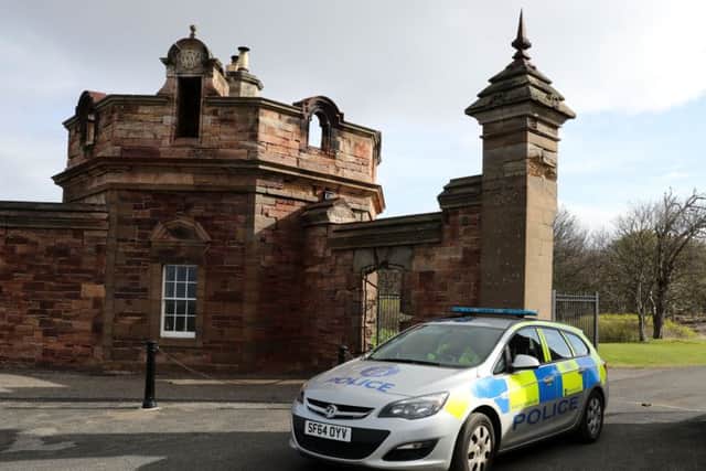 Police at the entrance to Gosford House in East Lothian, following the discovery of human remains. Picture; PA