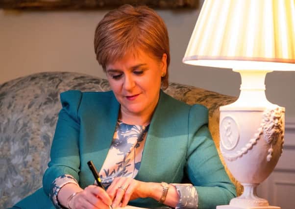 Picture Shows; Scotlands First Minister Nicola Sturgeon in the Drawing Room in Bute House, Edinburgh, working on the final draft of her Section 30 letter to the Prime Minister/ Picture; contributed