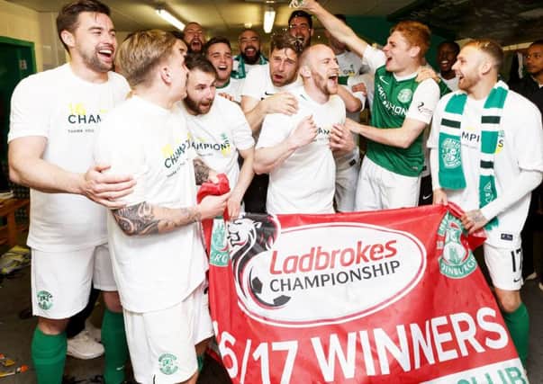 Hibs players celebrate their title win. Pic: SNS/Roddy Scott