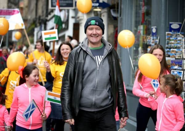 Scottish novelist Irvine Welsh takes part in a charity walk down Edinburgh's Royal Mile. Picture: Jane Barlow/PA Wire