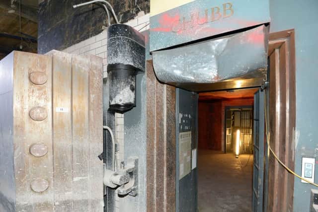 The door opens, revealing the bank vault. Picture:
 Neil Hanna