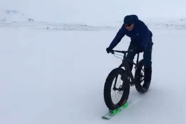 Sir Chris Hoy tries out the 'ski-bike'. Picture: Twitter/@chrishoy