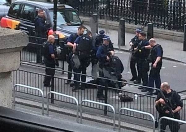 Police at the scene where a man has been arrested following an incident in  Whitehall in London. Picture: PA