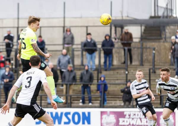 Hibernian's Jason Cummings rises high to put his side in front at Ayr. Pic: SNS/Roddy Scott