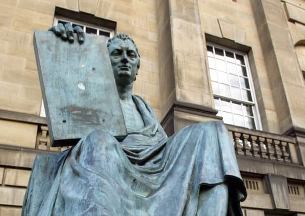 The bronze statue of Scottish philosopher David Hume in Edinburg. (AP Photo/Martin Cleaver)