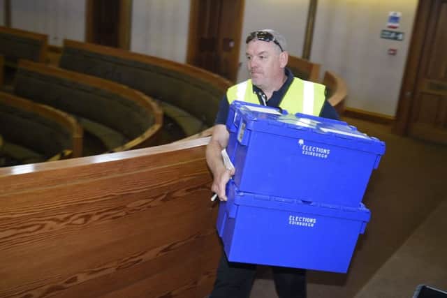 Ballot boxes and crates of ballot papers are loaded onto vans to be taken to polling stations for the Scottish council elections tomorrow. Picture: Greg Macvean