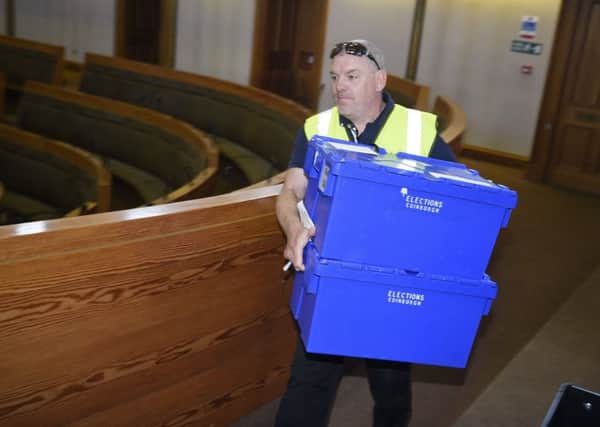 Ballot boxes and crates of ballot papers are loaded onto vans to be taken to polling stations for the Scottish council elections tomorrow. Picture: Greg Macvean