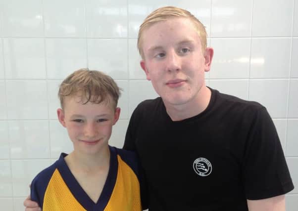 Midlothian swimmer Fraser gives young contestant Euan his gold medal