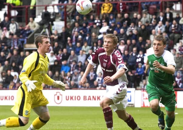 Andrew Driver nips in to steal the ball following the Hibs keepers mistake