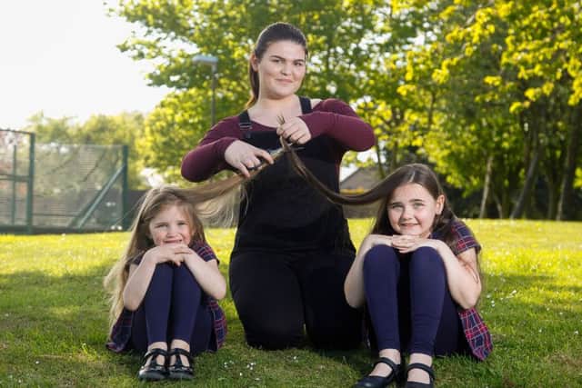 Alyx McLellan (5) and Brooke McLellan (8) are to have their hair cut for charity. Here they are posing with their big sister Zoe Blair(16).