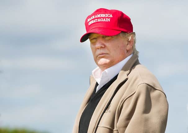 Donald Trump visits his golf course in Scotland in 2015. Picture: John Devlin