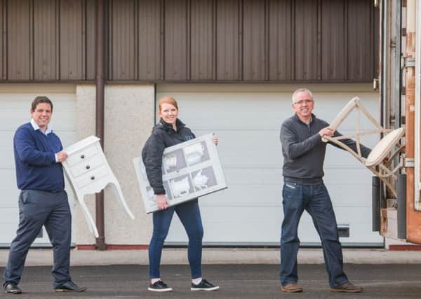 CALA homes' Claire McLoughlin, Keith Robertson, director at Fresh Start, and Stewart Ferguson Operations manager at Fresh Start help load the van with furniture. Picture: Ian Georgeson