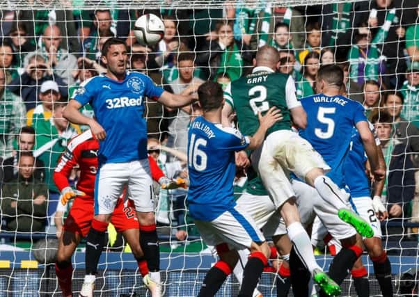 David Gray gets his head to the ball to score in added-on time at Hampden. Picture: Robert Perry