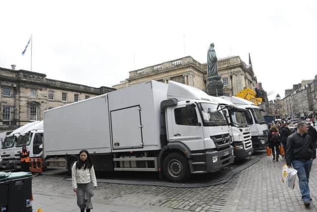 Trucks, cranes, lights and police boxes on the Royal Mile for filming of the new Avengers film. Picture: Greg Macvean