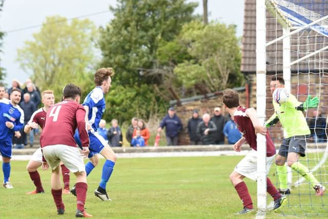 Roddy MacLennan's header just creeps over the line to give Bo'ness the lead against Linlithgow. Pic: David Lamb